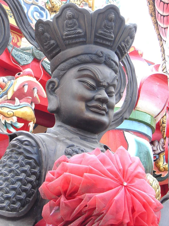 statues of buddhas with large heads and decorative decorations