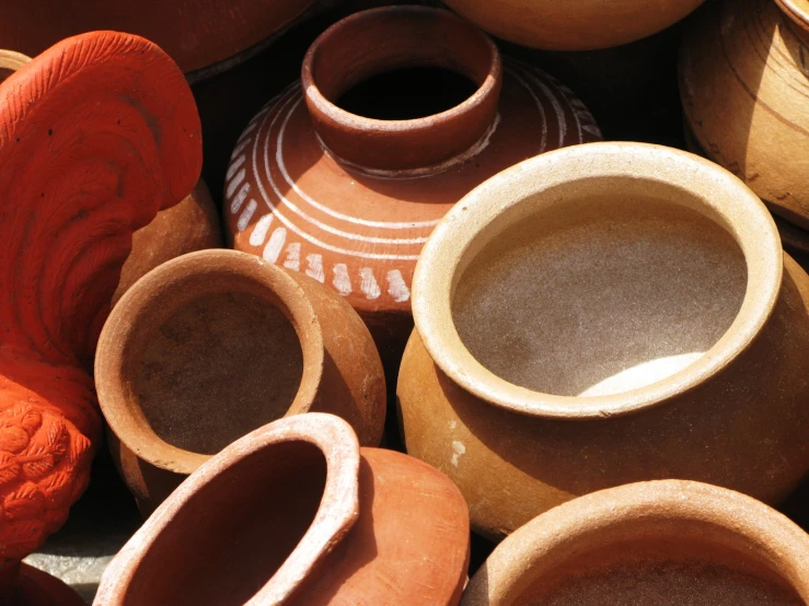 many clay pots all together in an arrangement