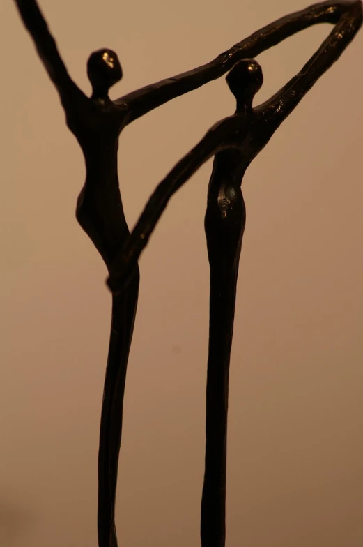 a metal sculpture in the center of a white background