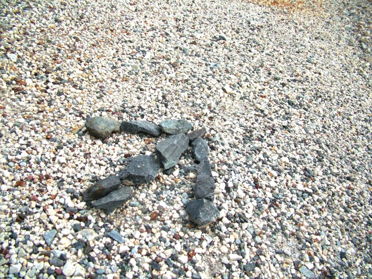 a small amount of gravel and rocks, that are next to each other