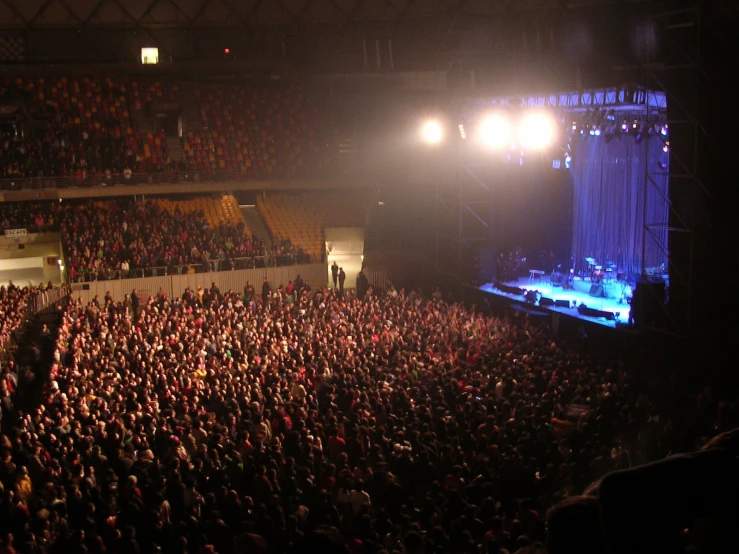 a crowd of people watching the audience at a concert