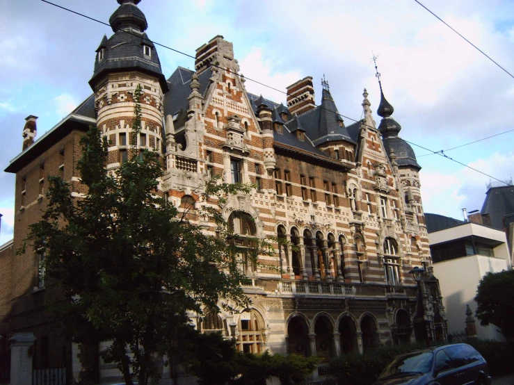 a large brick building with some towers