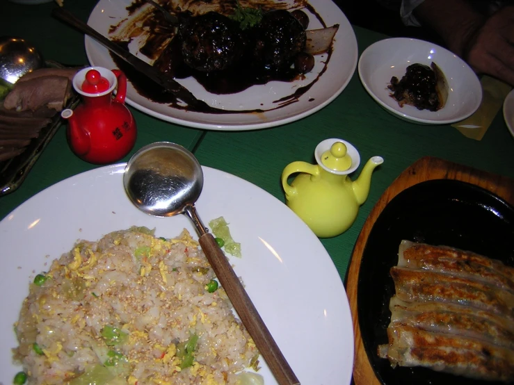 a plate of food on the table, with other plates and utensils