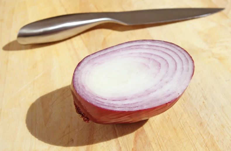 the onion on the  board has red ends
