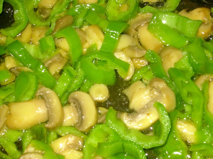 mushroom and green pepper mixture cooking in a set