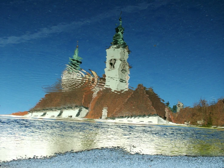 reflection of an old building in the water