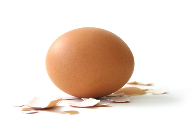 an egg is laying upside down and broken apart