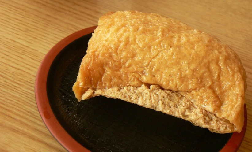 a piece of bread on a plate on the table