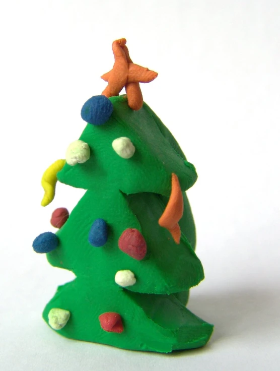 a toy tree made of clay with rocks