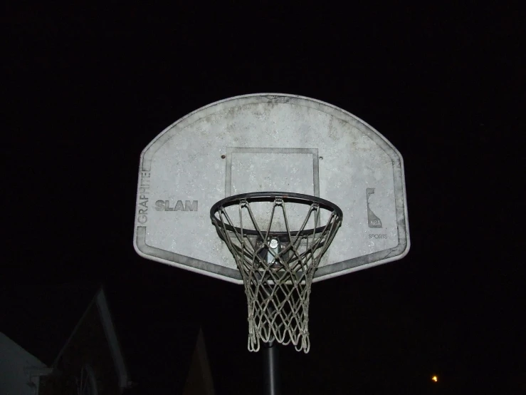 a close up of a basketball court at night