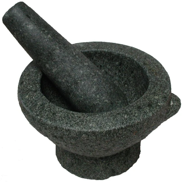 an antique mortar and pestle stand on white background