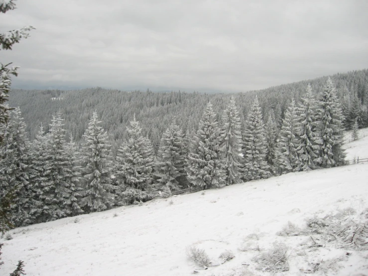 the mountains are covered in heavy snow