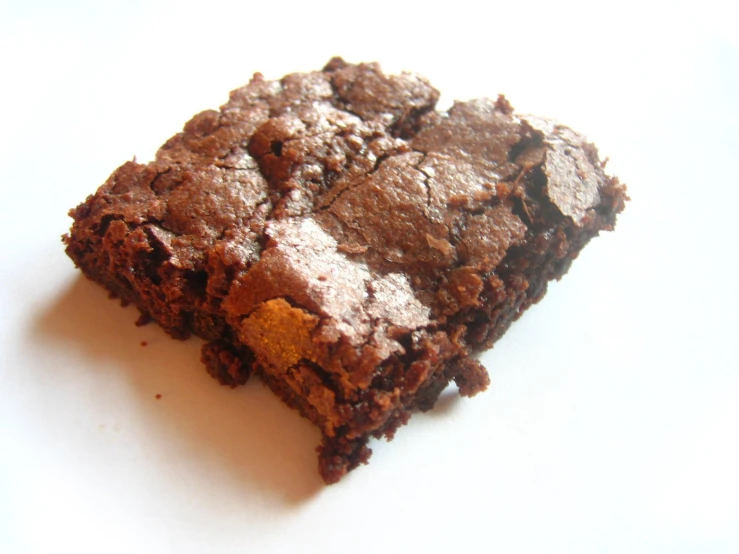 a chocolate brownie with an orange and white stripe