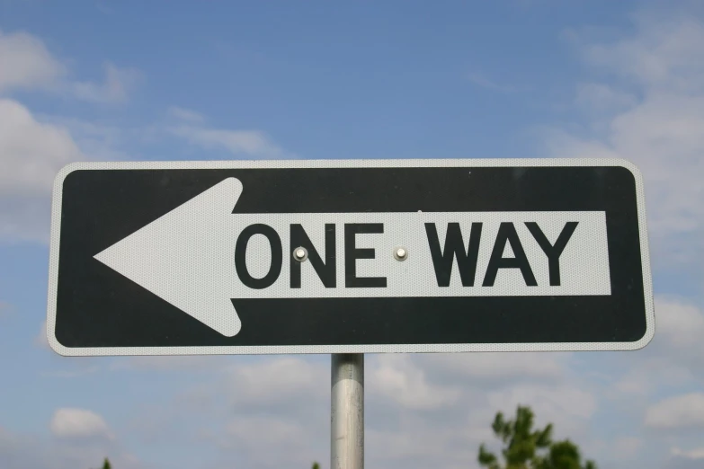 a one way street sign points right at an upward arrow