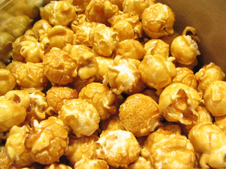 popcorn on a brown tray and some green peppers
