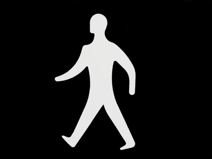 white man walking across a black square sign