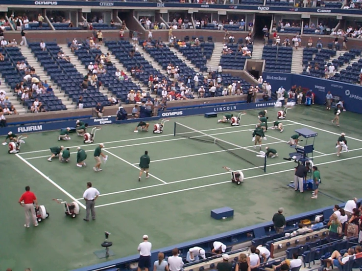 a group of tennis players play a match