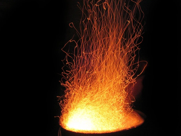 an iron casting with fire coming out of it