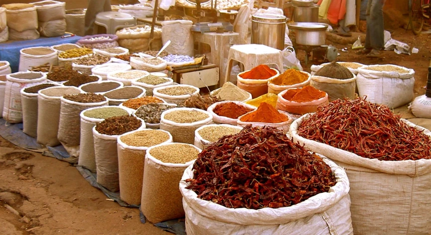 a group of bags sitting next to each other filled with spices