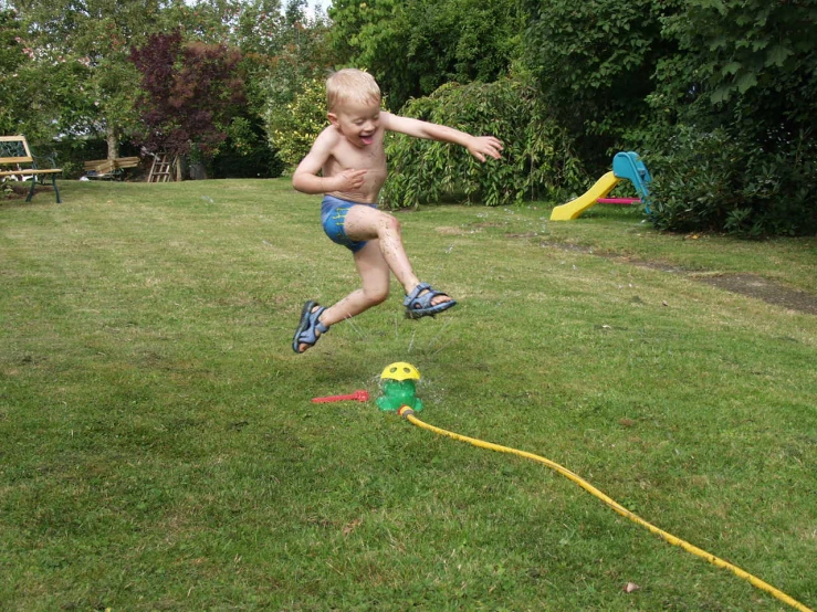 a child is playing with a toy in the yard