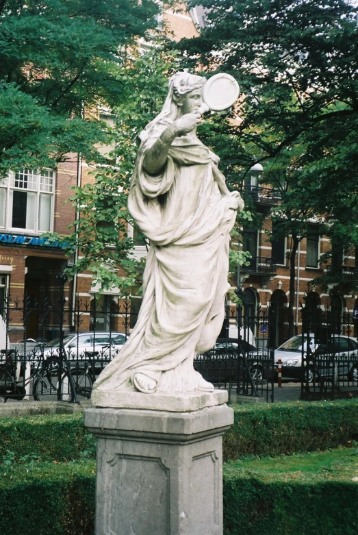 a statue of a woman holding a jug on her head