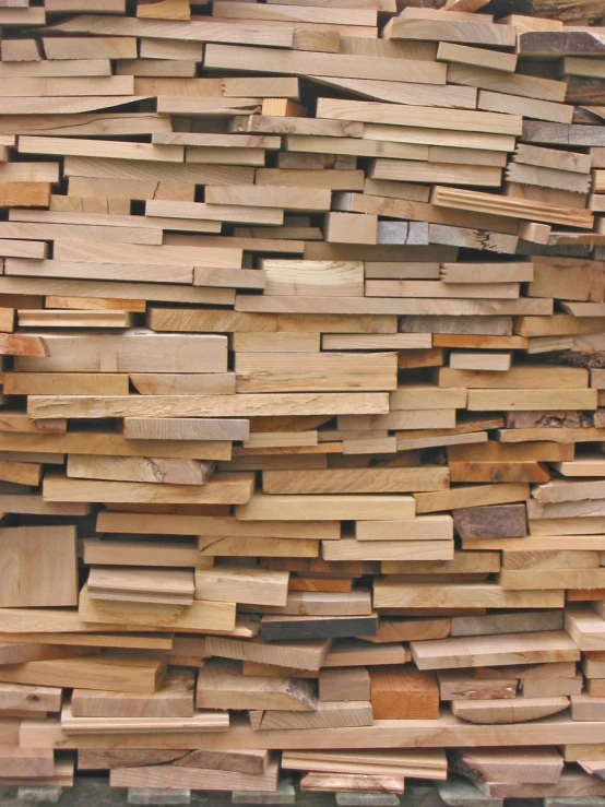 many large pieces of wood stacked together