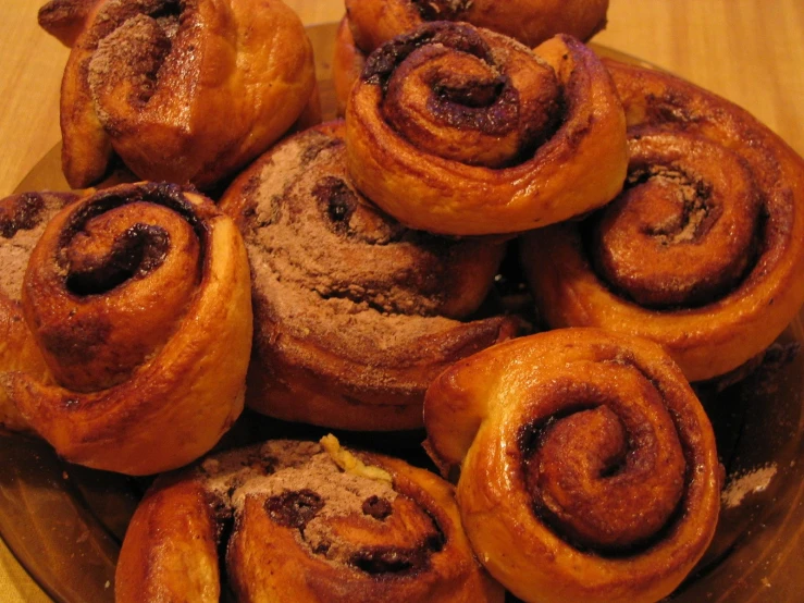 a bowl filled with lots of brown pastry