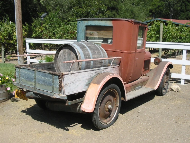 an old truck is parked in the street