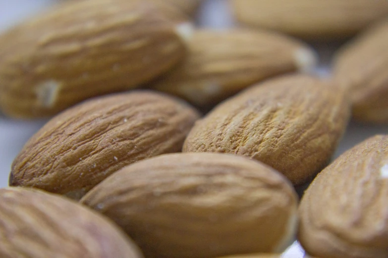 a close - up of almonds on white plate