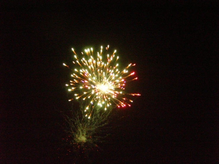 a lit up fireworks display in the night sky