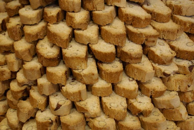 a large amount of brown bread pieces on top of a table