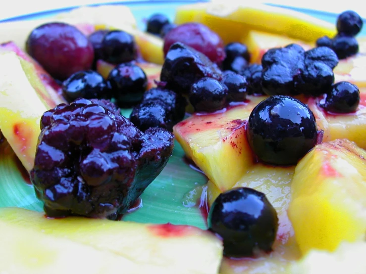 various fruits on a plate and one has berries