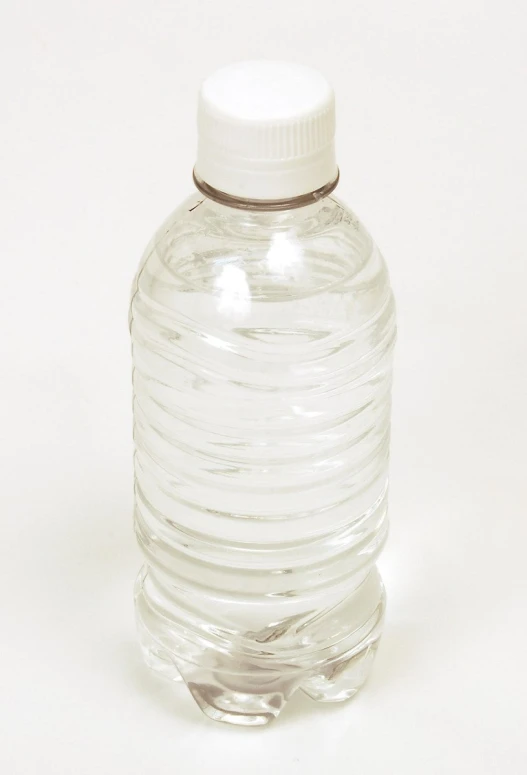 large glass bottle with white top sitting on a white background