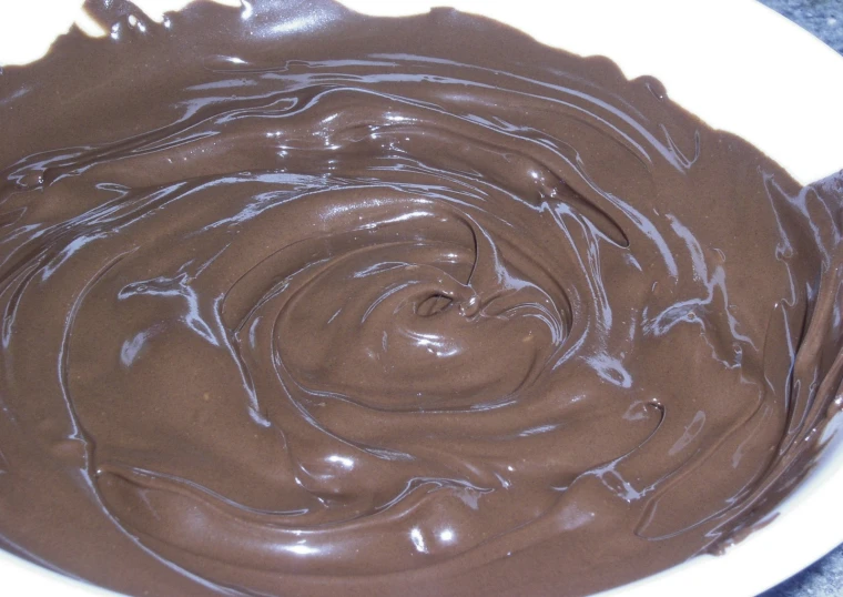 a chocolate swirled substance in a white bowl