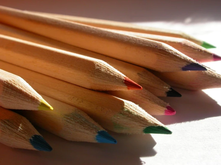 closeup po of several wooden colored pencils