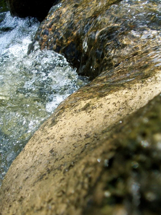 a close up of some water with rocks