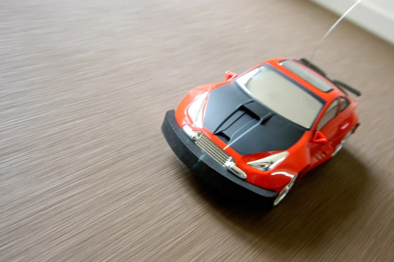 a toy car on the ground with no wheels