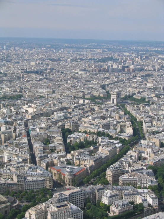 an aerial view of the city, buildings and trees