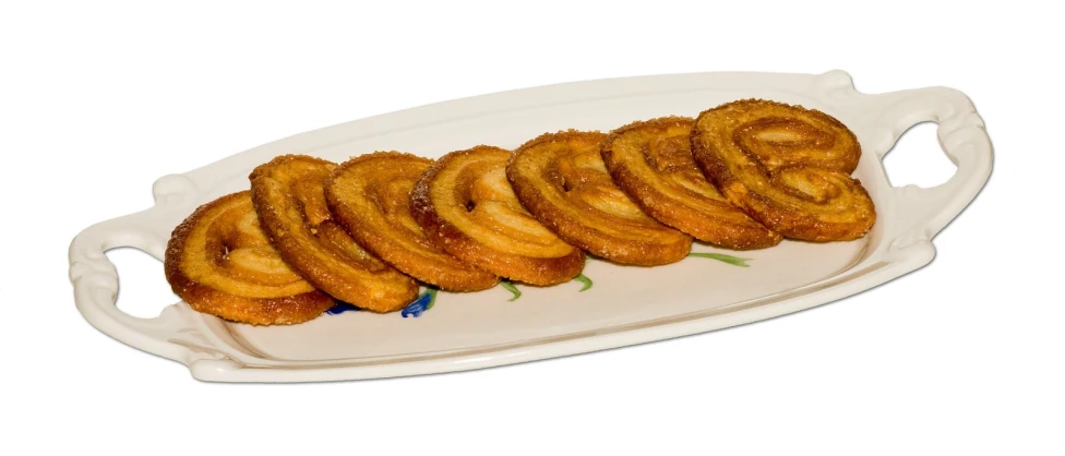 several onion rings are on a long plate