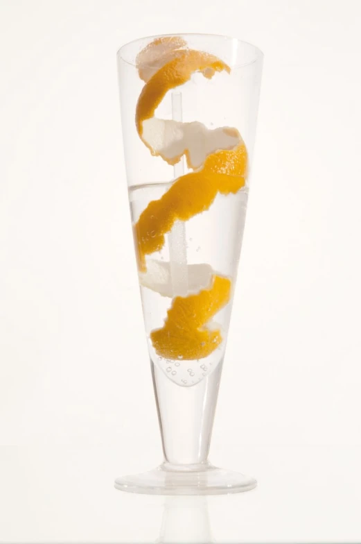 there is a glass filled with oranges and ice