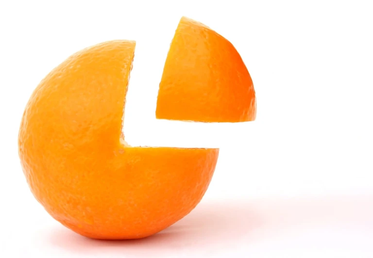 an orange with a cut in half arrow