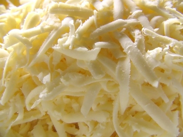 pieces of parmesan cheese are piled on top