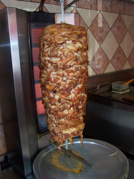 a bunch of meat skewers sitting on top of a grill