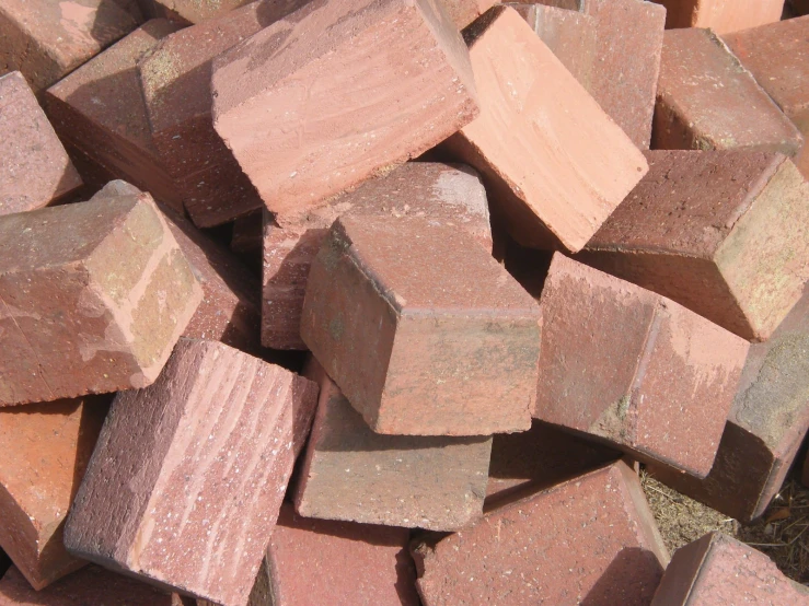a pile of pink bricks sitting on top of each other