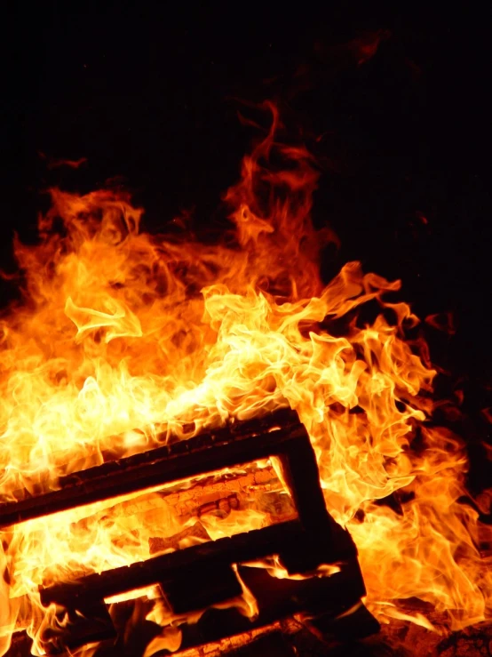 a bench sits in the middle of a burning area