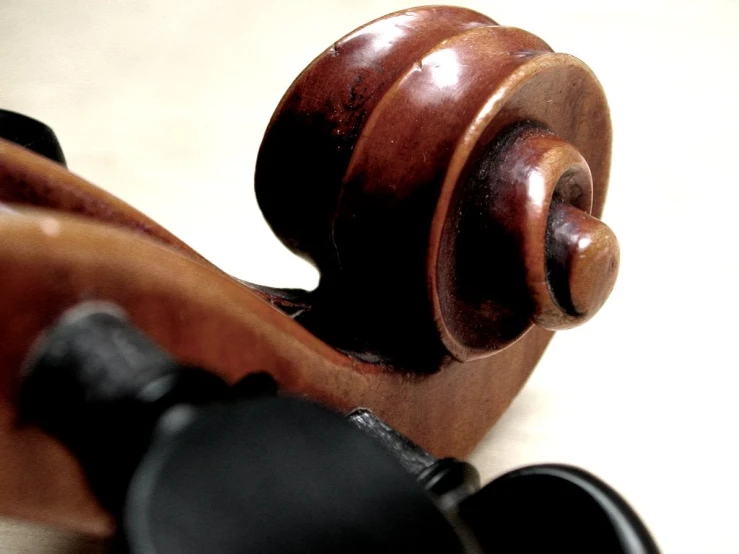 an antique violin laying on the floor