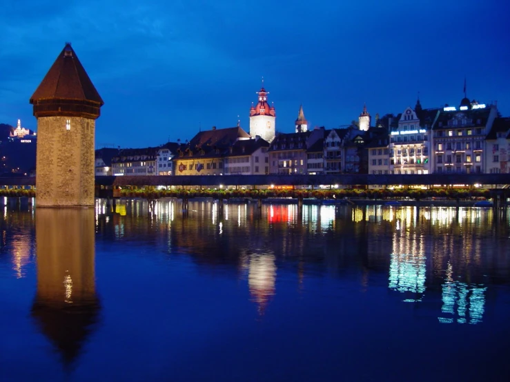 a tall tower on top of a body of water