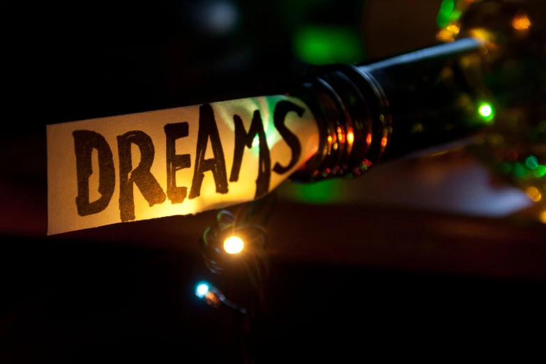 there is a sign that says dreams lit up