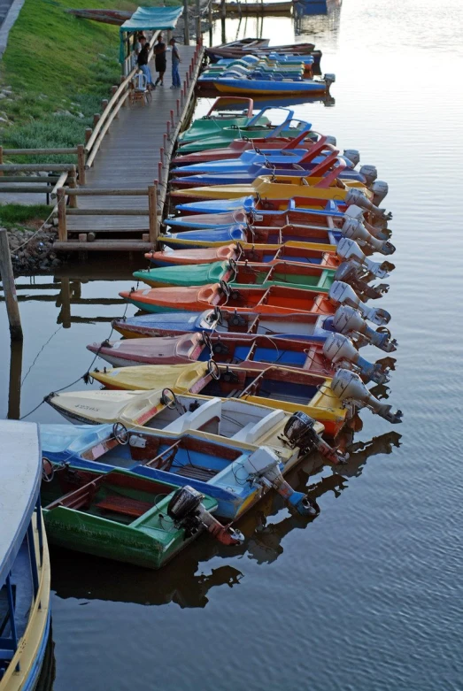 rows of boats lined up at the dock