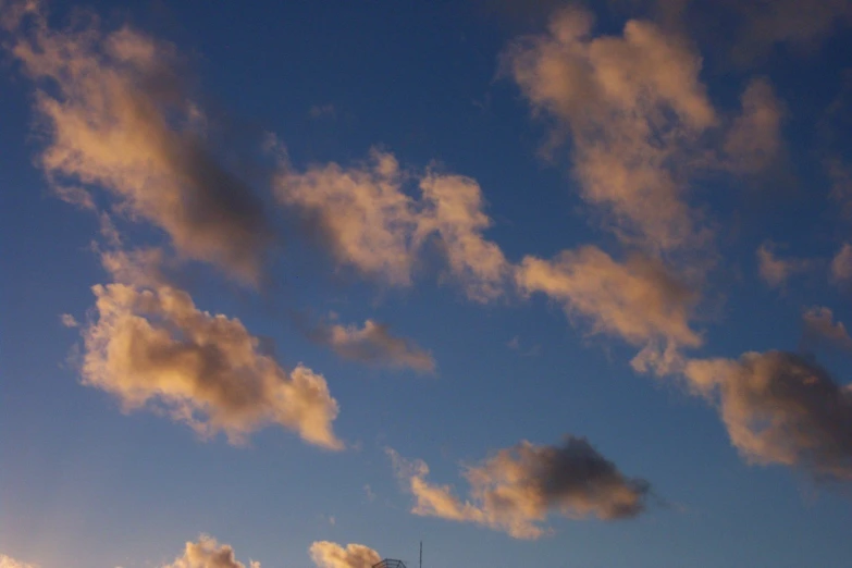 a po of clouds and buildings taken from the ground